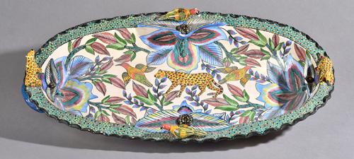 A large South African Ardmore Studio pottery oval shallow bowl, dated 2002, made by Octavia and painted by Ottilia, painted in the interior with a leo