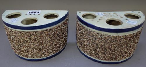 A pair of Staffordshire pearlware demi-lune bough pots, early 19th century, each top pieced with three large holes, the sides applied with a broad ban