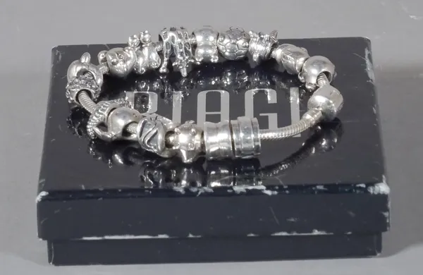 Carlo Biagi, a 20th century silver charm bracelet with fourteen charms, stamped 925.  CAB