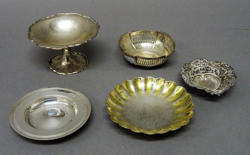 Silver, comprising; a circular dish of shallow fluted form, crest engraved to the centre, diameter 11cm, Birmingham 1837, a pedestal bonbon dish, a he