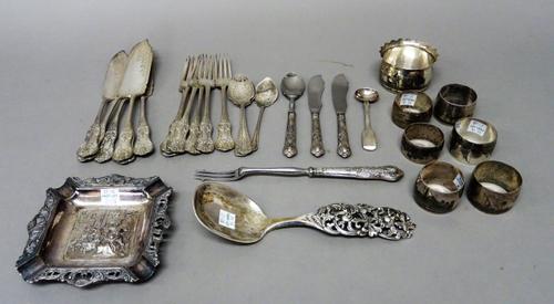 A group of niello wares, comprising; six various napkin rings and a bowl with a decorated rim, a silver salt spoon, a silver preserve spoon, an ashtra