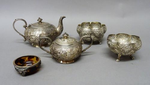 Asian and foreign wares, comprising; a teapot decorated with figures, palm trees and buildings, a twin handled sugar bowl and cover in a matching desi