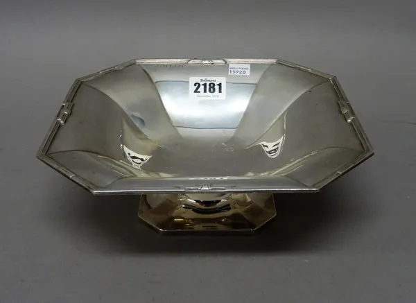 A silver cut cornered square pedestal dish, decorated with a reeded rim and raised on a cut cornered square foot, diameter 21cm, Birmingham 1936, weig