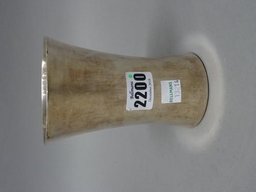 A silver vase, of waisted plain cylindrical form, presentation inscribed to the circular base, height 12.5cm, London 1906.  Illustrated.