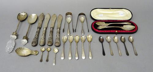 Silver flatware, comprising; a pair of Edwardian preserve spoons, each of spade form, with cast and engraved decoration, Sheffield 1902, two pairs of