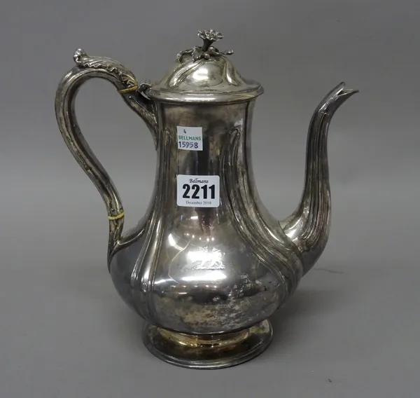 A Victorian silver coffee pot, of baluster form, with ridged decoration, the hinged lid with a flower finial, the body crest engraved London 1843, gro