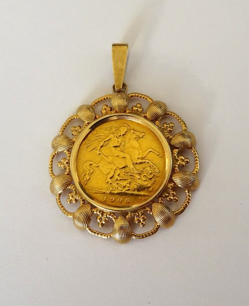 An Edward VII half sovereign 1906, in a 9ct gold pendant mount.