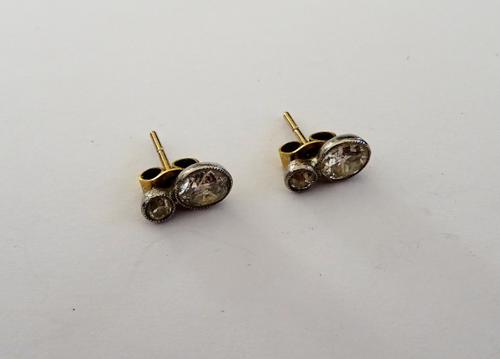 A pair of diamond set two stone earstuds, each mounted with a cushion shaped diamond and with a smaller cushion shaped diamond above, the backs with p