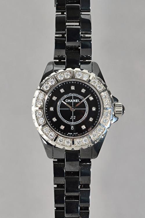A Chanel J12 diamond dial black ceramic quartz watch H2000. Black ceramic case with a black ceramic bracelet. Unidirectional silver-tone set with 24 d