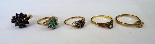 A 9ct gold, emerald and diamond cluster ring, a gold and diamond single stone ring, detailed 18 CT, a gold and sapphire cluster ring (one sapphire lac