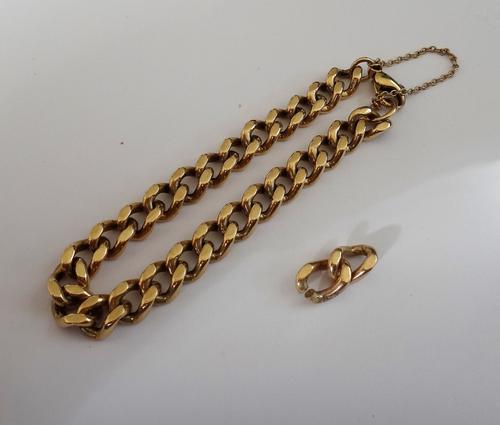 A 9ct gold faceted curb link bracelet, with a sprung hook shaped clasp, fitted with a safety chain, with two extra links, weight 39 gms.