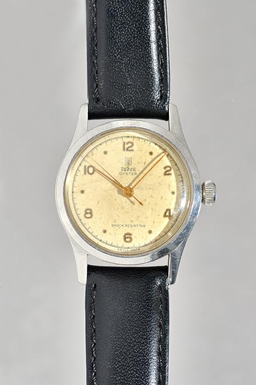 A Tudor Oyster steel circular cased gentleman's wristwatch, the signed silvered dial with gilt Arabic and dot numerals, gilt hands and with centre sec