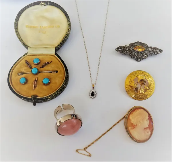 A gold, sapphire and colourless gem set oval cluster pendant, with a gold neckchain, with a box, a 9ct gold mounted oval shell cameo brooch, carved as