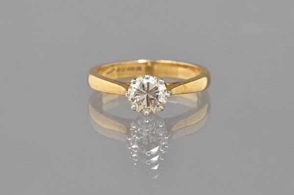 An 18ct gold and diamond single stone ring, claw set with a circular cut diamond, ring size L and a half. Illustrated.
