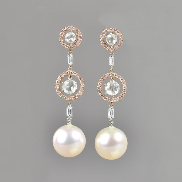A pair of cultured pearl and diamond pendant earrings, the halo set principal rose cut diamonds suspending the large cutlured pearl and with baguette