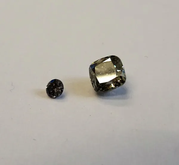 A cushion-cut loose diamond, 0.65ct., fancy light grey, 11, together with a small round brilliant grey blue loose diamond, 0.06ct, (2)This Lot is subj