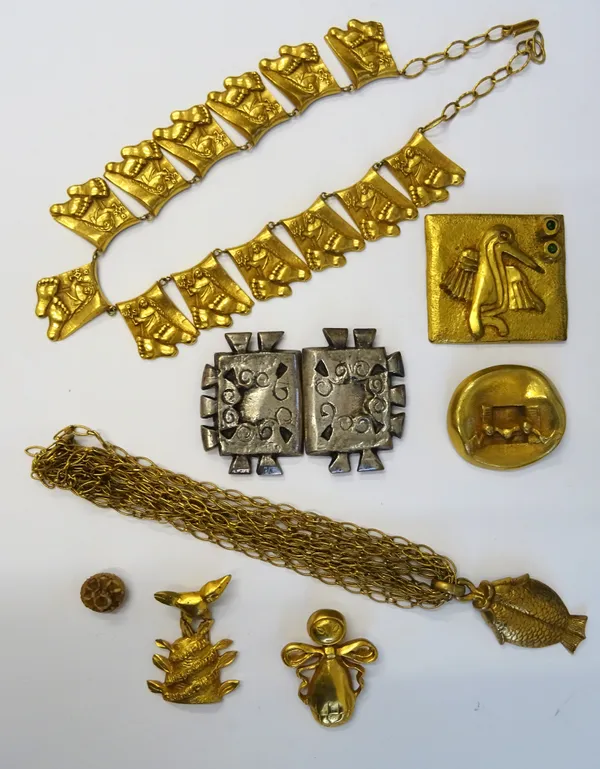 A group of gilt metal jewellery, comprising; a brooch designed as a stylized figure, detailed LINE VAUTRIN, three further brooches, a collar necklace,