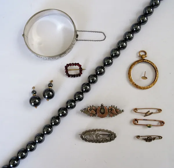 A Bohemian garnet set brooch, in an openwork rectangular design, three gem set lace pins, two silver brooches, a 9ct gold mounted circular pendant loc