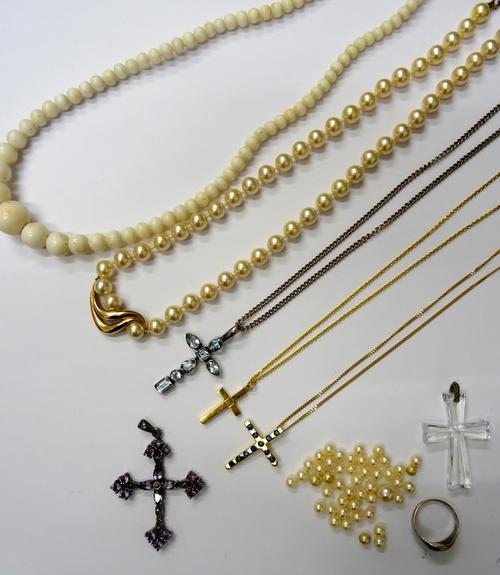 A gold and sapphire set pendant cross, detailed 750, with a gold neckchain, on a boltring clasp, detailed 750, an 18ct gold pendant cross, with an 18c