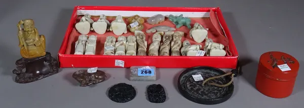 A group of Chinese jade and hardstone carvings, two soapstone carvings of water buffalo and seated figure, a Chinese bronze mirror, a Japanese red lac