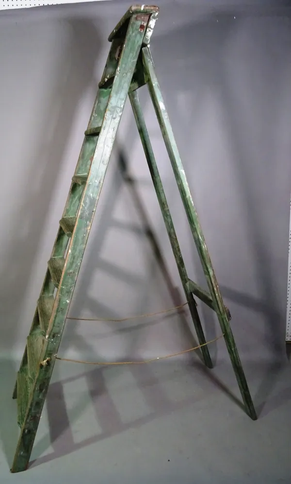 An early 20th century green painted eight rung 'A' frame ladder, 210cm high.   H9