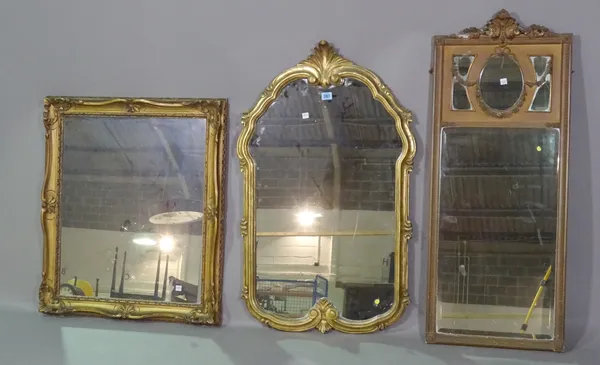 A large gilt framed mirror, 57cm wide x 90cm high and two further smaller, (3).   G9