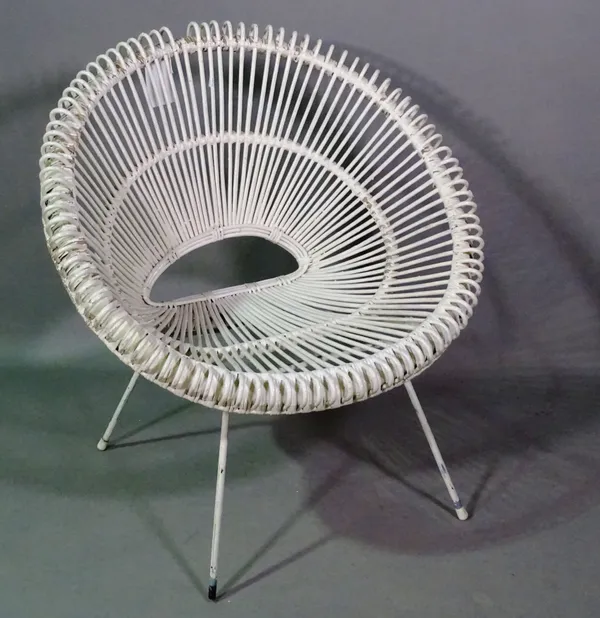 A mid-20th century white painted rattan low armchair.   K8