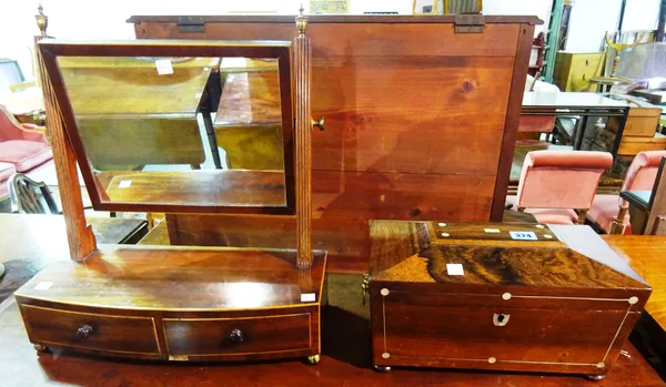 A Regency rosewood sarcophagus shaped twin division tea caddy and a 19th century rectangular swing frame mirror on a two drawer base, (2)  E6