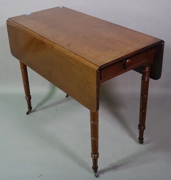 A Regency mahogany drop flap table on turned supports, 46cm wide x 92cm long.   E5