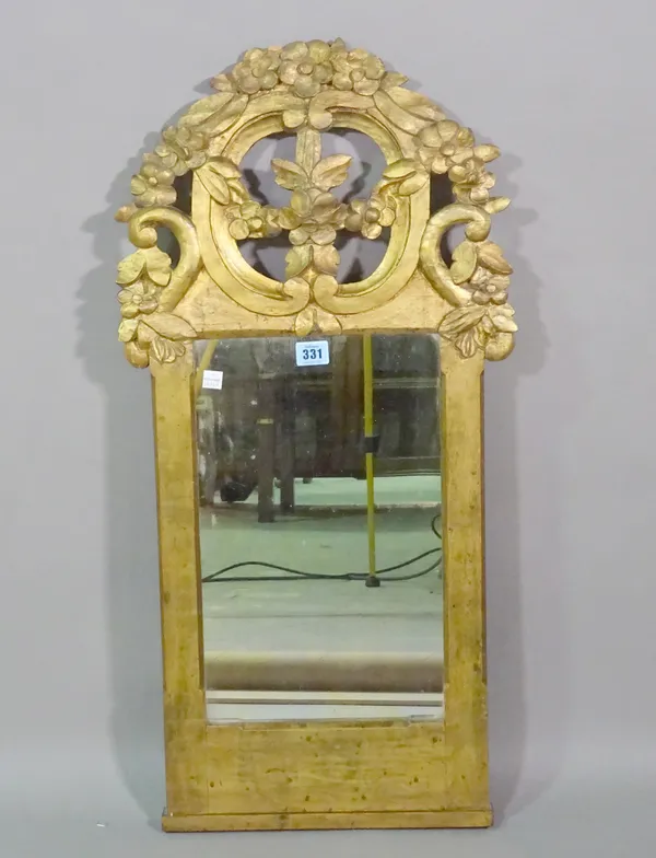 A 19th century Continental gilt framed wall mirror with floral crest, 39cm wide x 79cm high.   J5