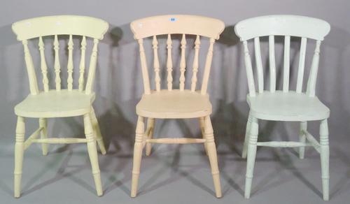A matched set of six 20th century painted pine stick back dining chairs, each in a different colour, (6).   BAY 2