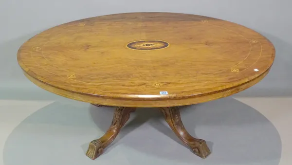 A Victorian rosewood and satinwood inlaid oval low table on four downswept supports, 136cm wide x 52cm high.   D4