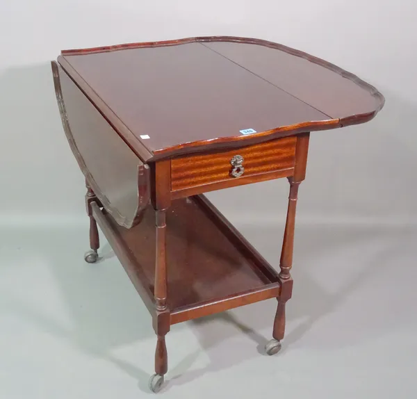 A 20th century mahogany two tier drop flap serving trolley with pie crust top, 78cm wide x 72cm high.  G6
