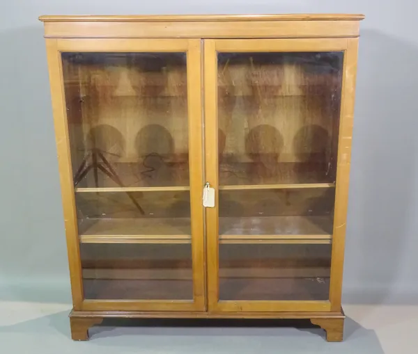Maple Quality; a 20th century mahogany bookcase cabinet on bracket feet, 106cm wide x 126cm high.  E9