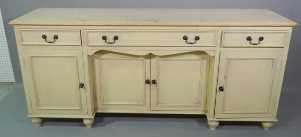A 20th century yellow painted sideboard, with three drawers over four door cupboard base on tapering supports, 180cm wide x 78cm high.   ROST