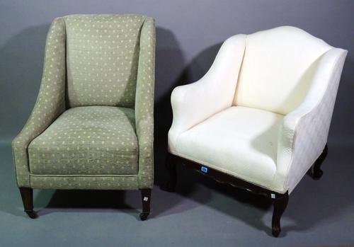 An early 20th century mahogany framed low armchair on scroll supports with white upholstery and another similar, (2). D4
