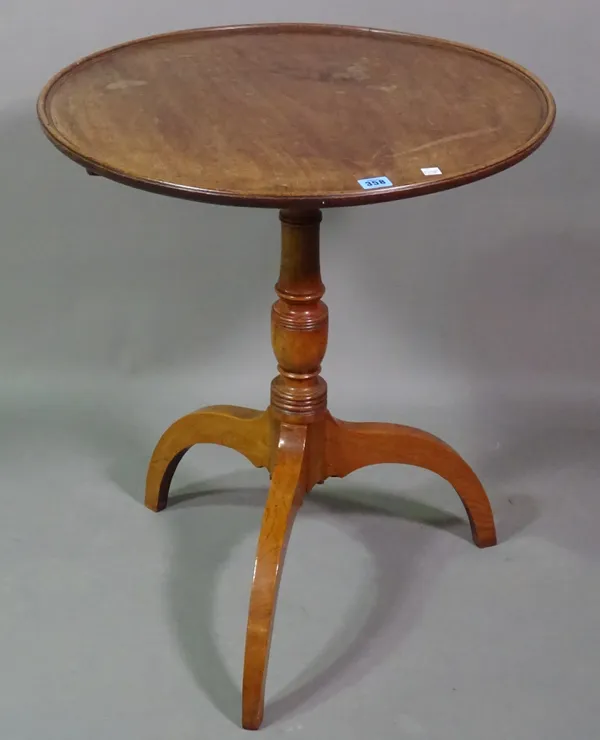 A Victorian mahogany circular tripod table on ring turned column support, 61cm wide x 71cm high.  I7