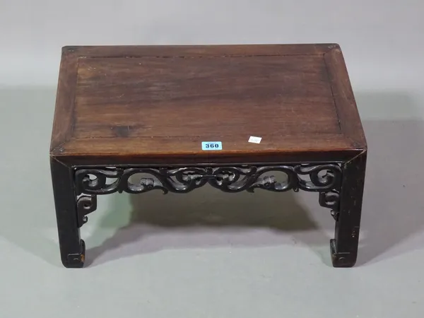 A Chinese hardwood low occasional table, with carved scrolling frieze on square legs, 50cm wide x 20cm high  F9