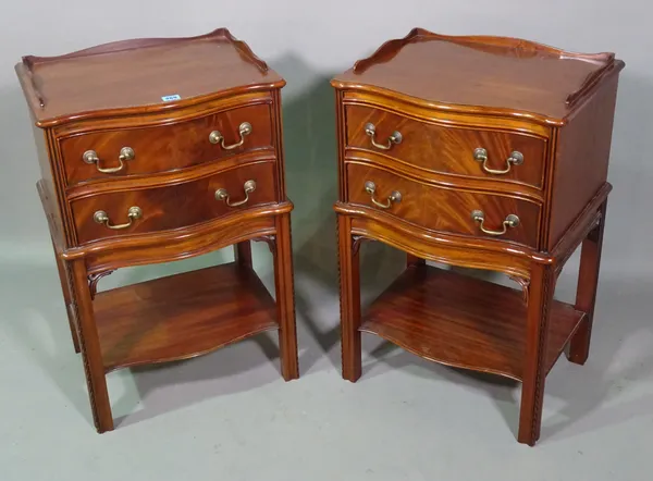 A pair of George III style mahogany two drawer serpentine bedside tables, 47cm wide x 75cm high, (2).   F4