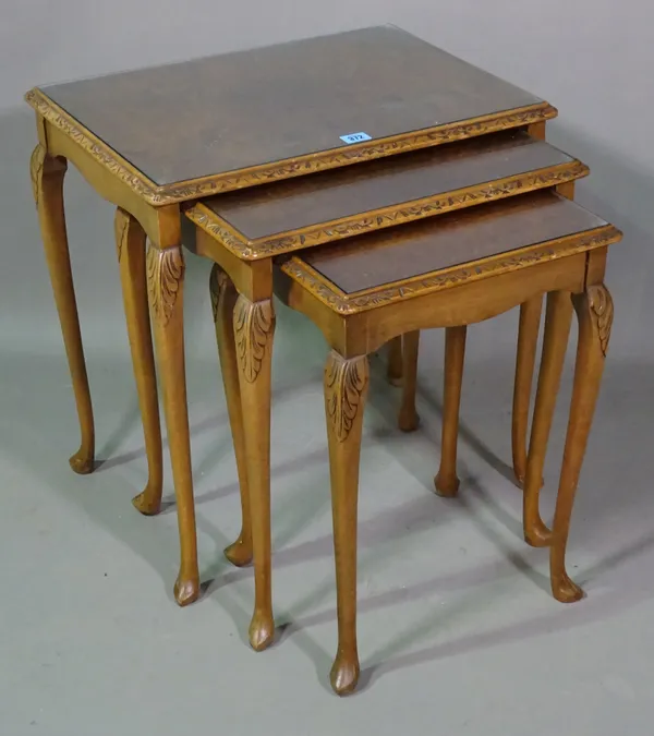 A Victorian style walnut nest of three tables on cabriole supports, the largest 54cm wide x 55cm high, (3).   H8