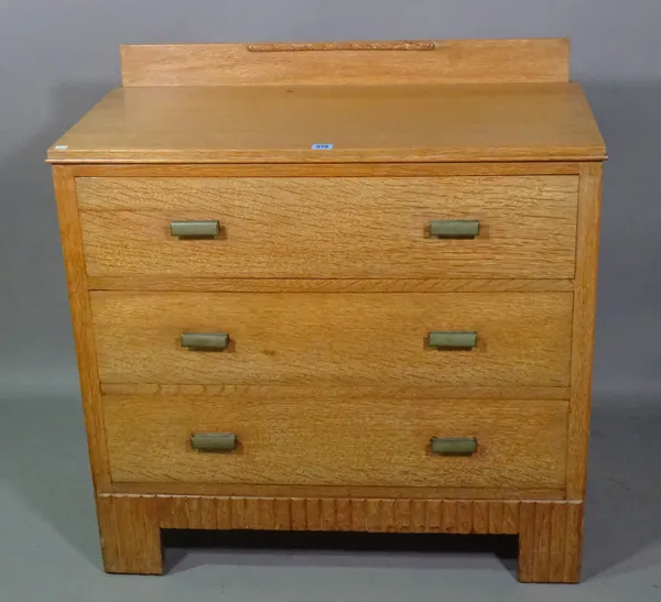 A 20th century limed oak chest of three long drawers on block supports, 84cm wide x 86cm high.   H7