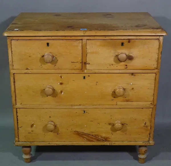 An early 20th century pine chest of two long drawers on turned supports, 83cm wide x 85cm high.   H7