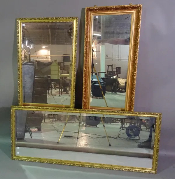 Four 20th century gilt framed rectangular mirrors, the largest 72cm wide x 130cm high and a 20th century oak framed rectangular wall mirror, 90cm wide