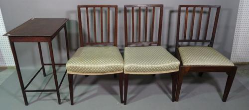 A set of three early 19th century mahogany fluted stick back dining chairs and a George III and later mahogany side table, 57cm wide x 72cm high, (3).