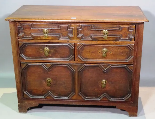 An early 18th century and later oak chest of two short and two long graduated drawers with geometric moulded decoration, 100cm wide x 78cm high  G6