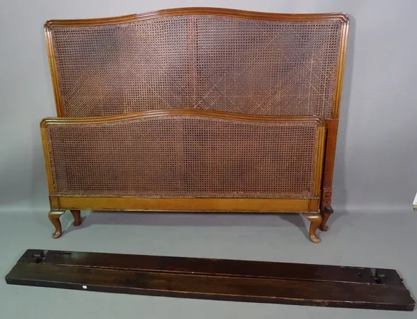 Heal & Sons; a 20th century mahogany and canework double bed, 150cm wide x 125cm high and a matching single bed, 105cm wide x 125cm high, (2).   J9