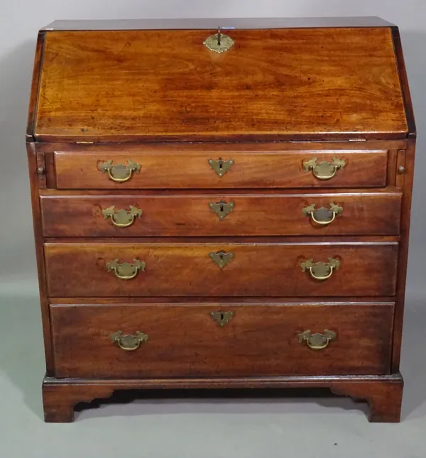 A George III mahogany bureau with four long graduated drawers on bracket feet, 92cm wide x 100cm high.   J6