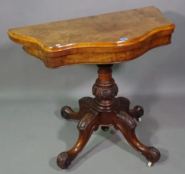 A Victorian burr walnut serpentine card table on turned column and four acanthus carved downswept supports, 90cm wide x 74cm high.   J4