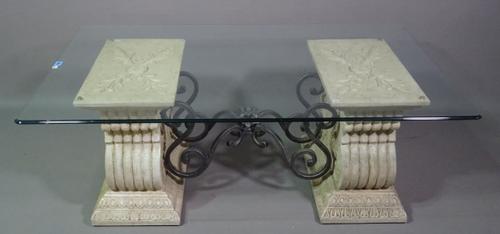 A 20th century coffee table, the rectangular glass top on pair of scroll supports, united by wrought iron stretcher, 76cm wide x 132cm long.   B7