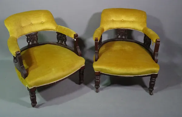 A pair of 19th century mahogany framed low open armchairs with green upholstery, (2).   D4